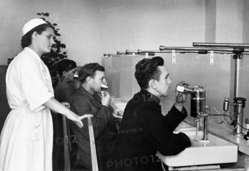 Soviet health spa, miners of the sophia colliery in the stalino region of the ukraine receiving inhalation treatment at a new facility, the network of medical and prophylactic institutions is growing steadily, new dispensaries and polyclinics with the latest equipment have been opened in mining districts, august 1952.