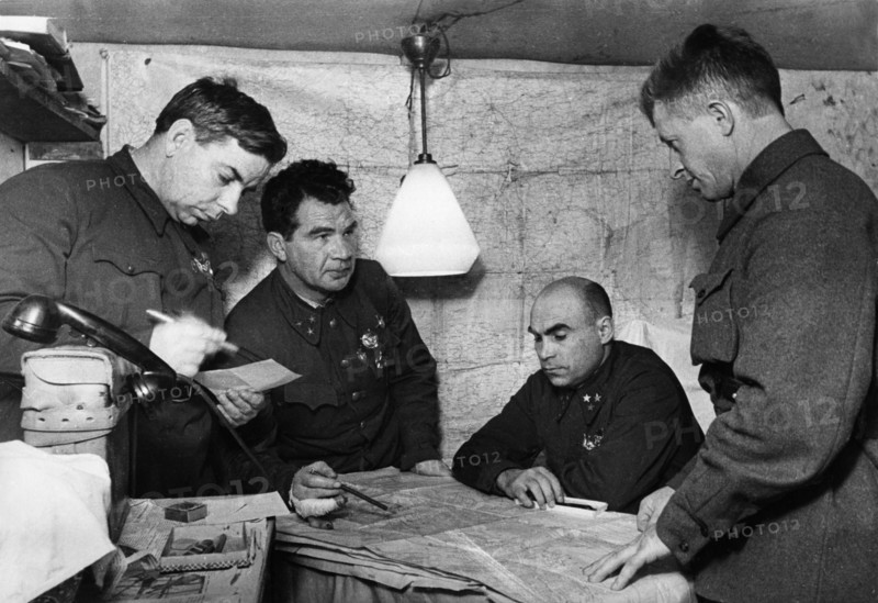 Lt, general vasili chuikov (2nd from left) giving an assignment to the commander of the 13th guards rifle division, major general alexander rodimtsev (far right), in the command post bunker of the 62nd army in november 1942, stalingrad, also present are major general n, i, krylov (far left) and member of the military council, lt, general k, a, gurov (2nd from right).