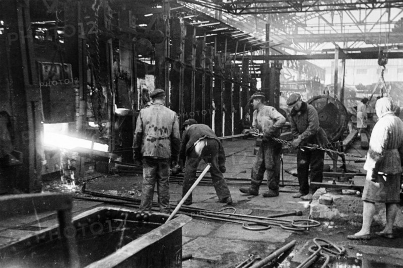 Workers of the krasny oktyabr iron and steel works back at work at the restored plant in stalingrad, ussr, 1940s.