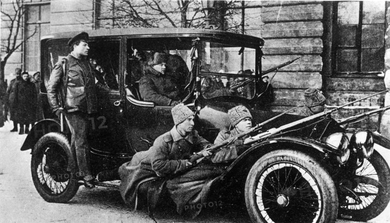Armed revolutionary soldiers patrolling the streets of petrograd during the february bourgeois democratic revolution in 1917.
