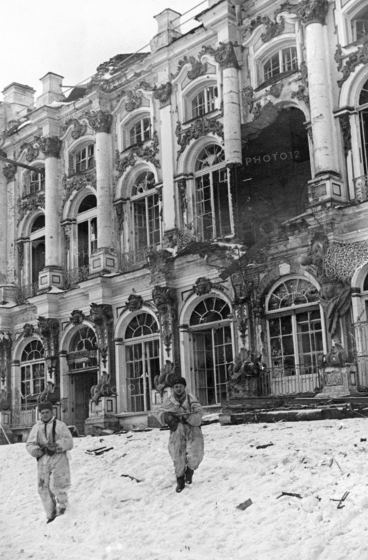 Soldiers in front of catherine palace in tsarskoye selo which has been severely damaged by the germans, january 1944.