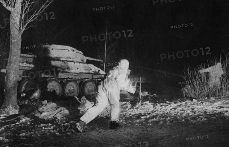Red army troops and a t-34 tank during a night engagement, world war 2, february 1944.