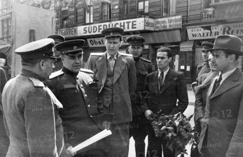 Colonel-general berzarin, soviet commandant of berlin (second from left) chatting with officials of the berlin subway after a ride on the underground railway, 1945 or 1946.