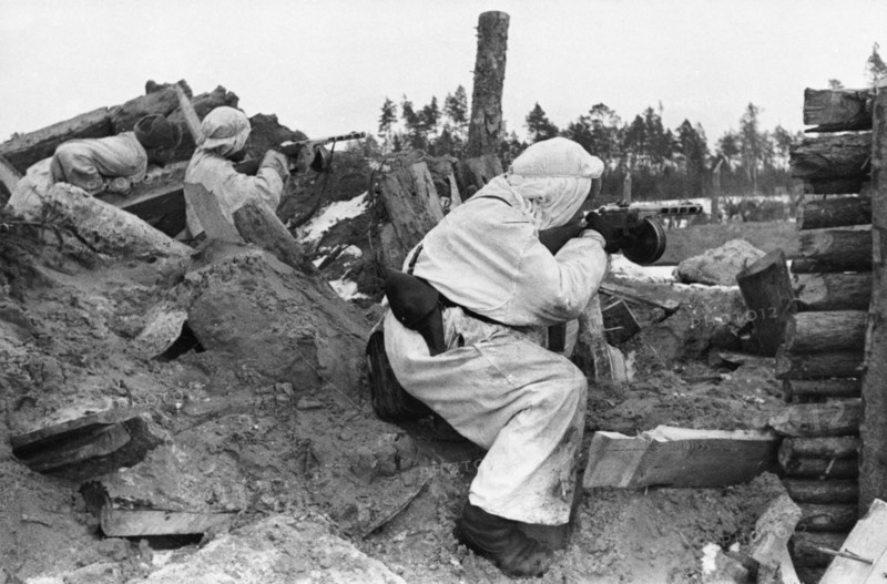 Red army tommy-gunners who have captured a german fortification firing on a retreating enemy, april 1944.
