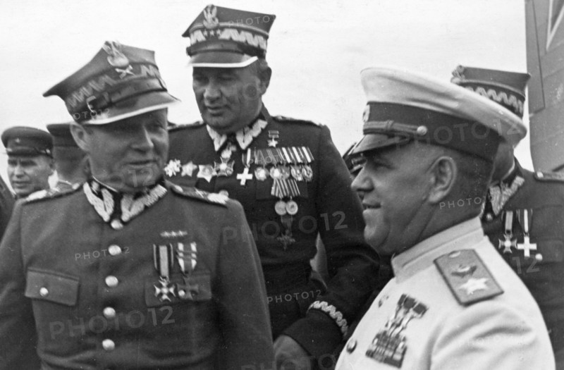 Marshals georgy zhukov and rokossovsky receive highest awards from the polish military, marshal m, rola-zymierski, commander-in-chief of the polish army, zhukov, and colonel-general s, poplawski at the warsaw aerodrome, 1945,world war 2.