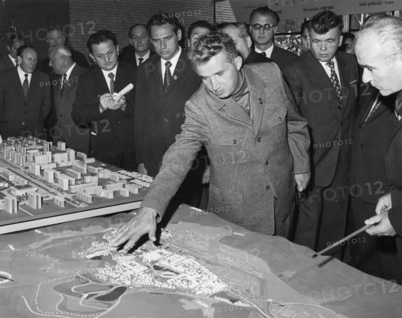 Romanian president nicolaae ceausescu talks with experts and town councillors about the extension of the iron and steel combine and development of hunedoara town, romania, 1970s.