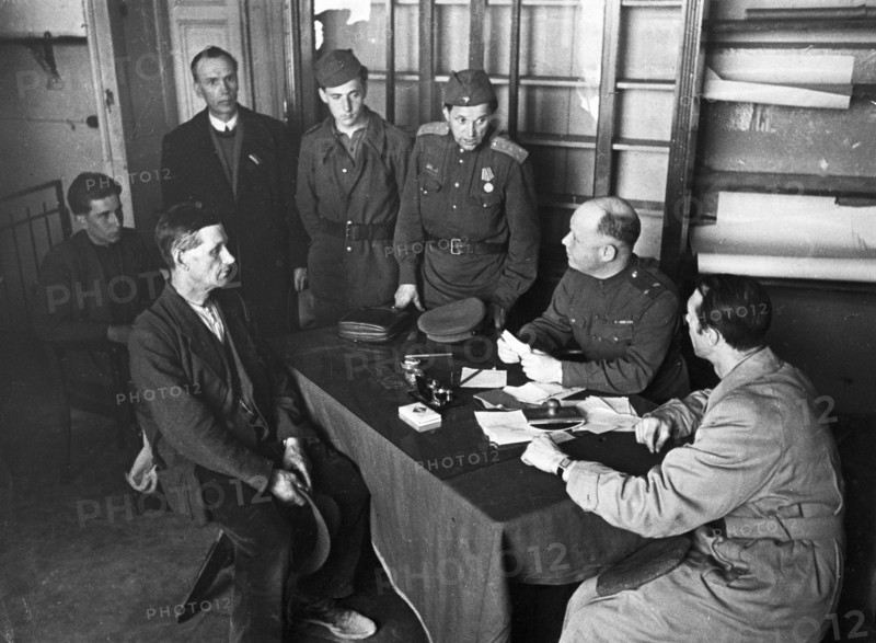 Lieutenant-colonel ugryumov, military commandant of the central district of berlin, receiving visitors, 1945 or 1946.