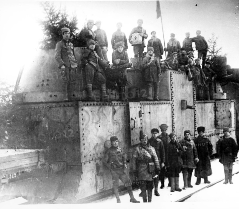 Red army soldiers near an armored train during the kronshtadt revolt in 1921.