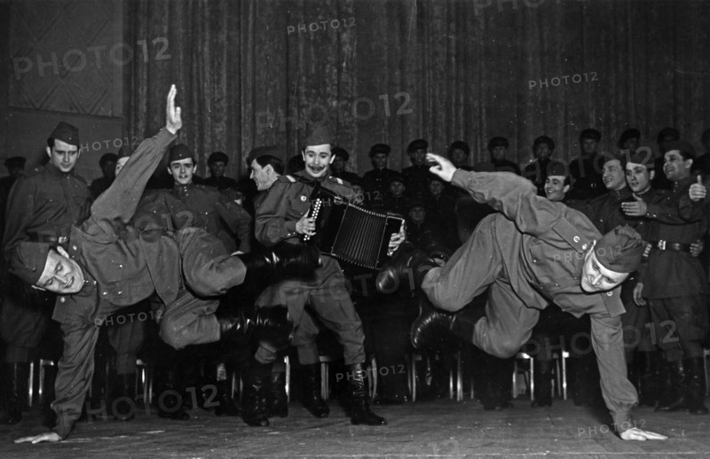 Soviet army dance ensemble performing 'during a halt' in moscow, ussr in the 1950s.