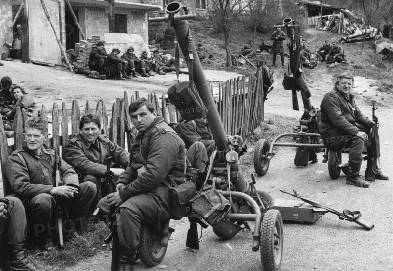 Yugoslav army reservists resting before entering bosnian town of visegrad, 170 km south of belgrade, war, 1992, yugoslavia.