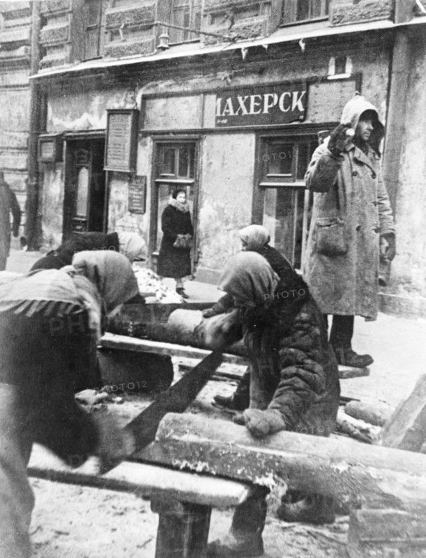 Siege of leningrad (sawing-wood for fuel).