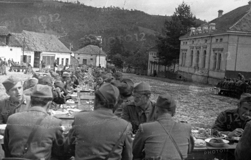 World war 2, soldiers of the (yugoslavian) national liberation army at a dinner arranged for them in the town of brus, december 1944.