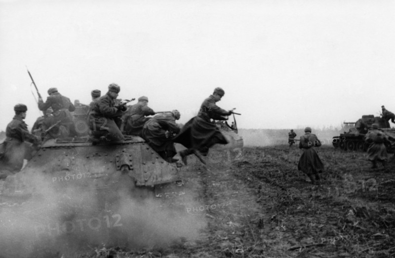 World war 2, 2nd ukrainian front, tank-borne soviet infantry attacking on the approaches to budapest, hungary, december 1944.