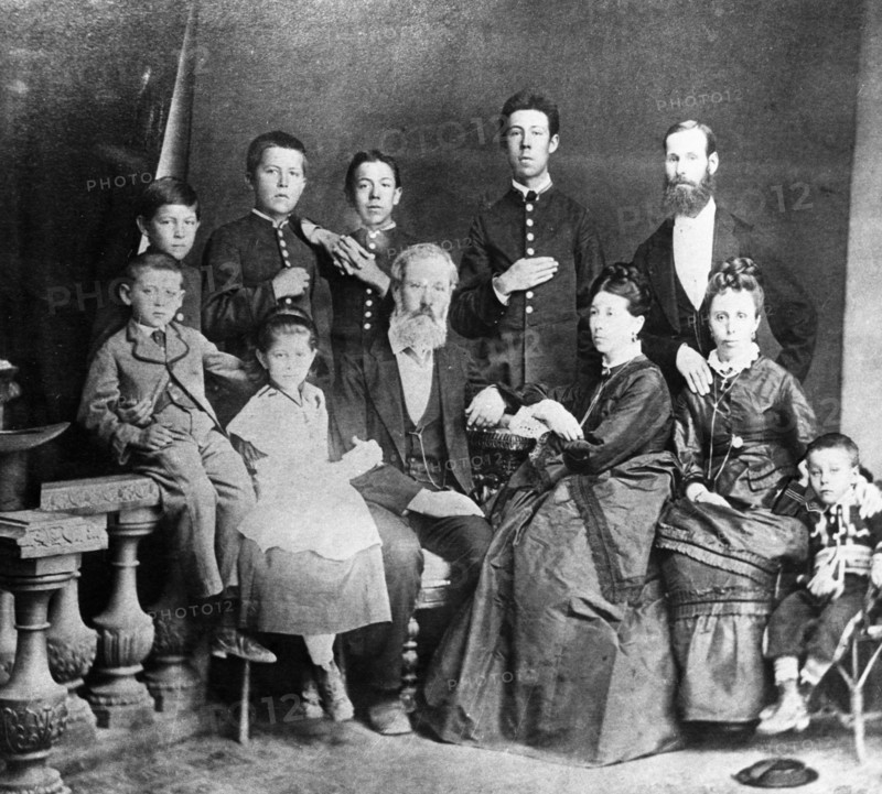 Chekhov family portrait, in the center, sitting, are the parents,pavel and yevgenia chekhov, on the left are mikhail and maria, on the right is aunt lyudmila with her son georgy, standing (from left) are ivan, anton, nikolai, alexander, and uncle mitrofan, 1874 or 1875.