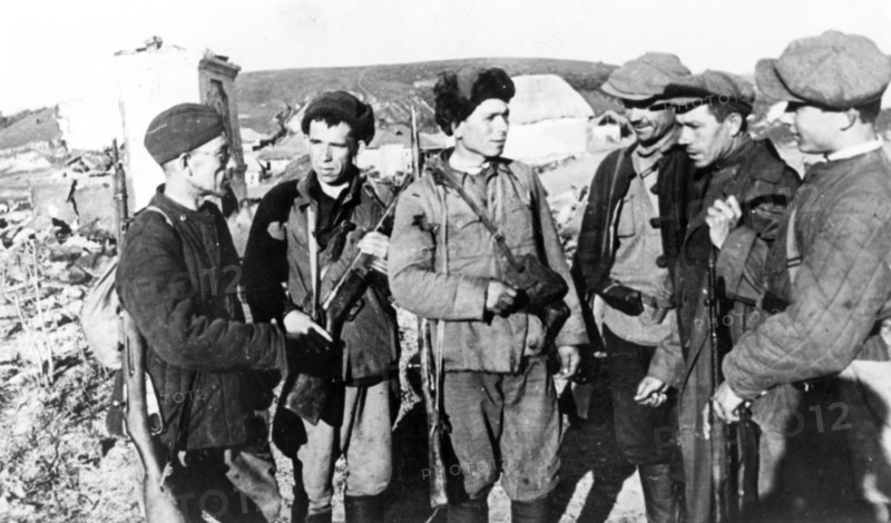 Guerrillas who returned to their native village liberated by the red army during world war ll.