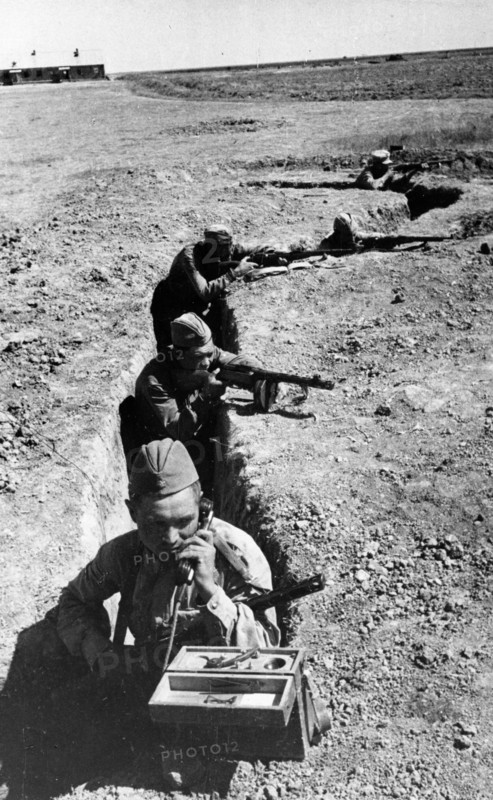 A soviet signalman in a trench in the don valley transmitting a dispatch to the forward edge of defense lines, august 1942.
