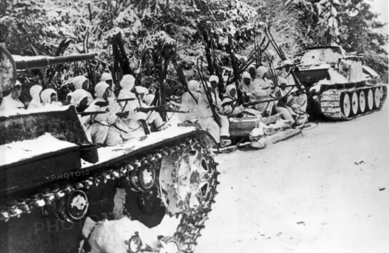 Red army skiers riding on sledges and tanks to the advanced lines, during world war ll.