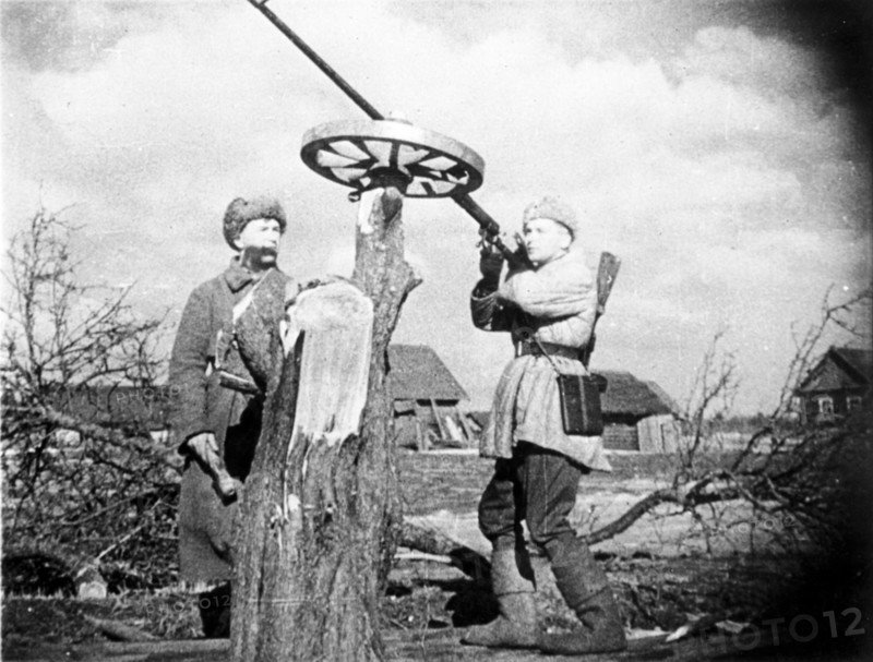 Soviet guerrillas man made an anti-aircraft gun made from an anti-tank rifle mounted on a wheel.