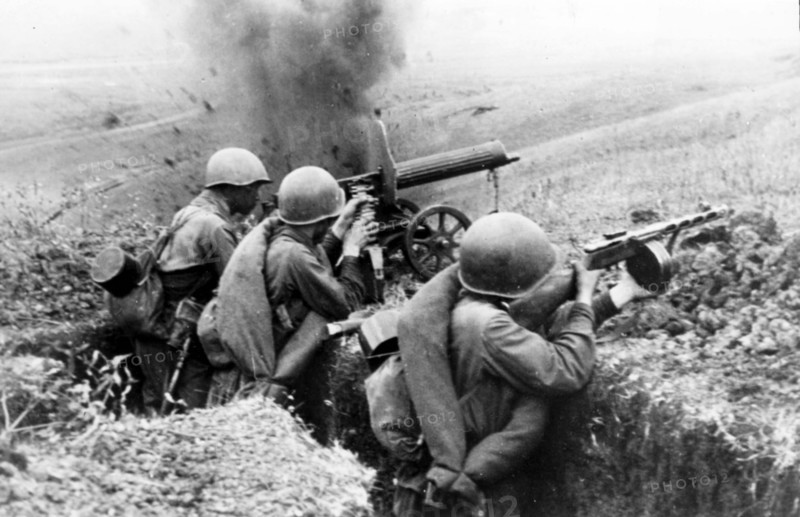 Machine-gunners firing at the germans during battle for a height in the northern caucasus during world war ll, 1942.
