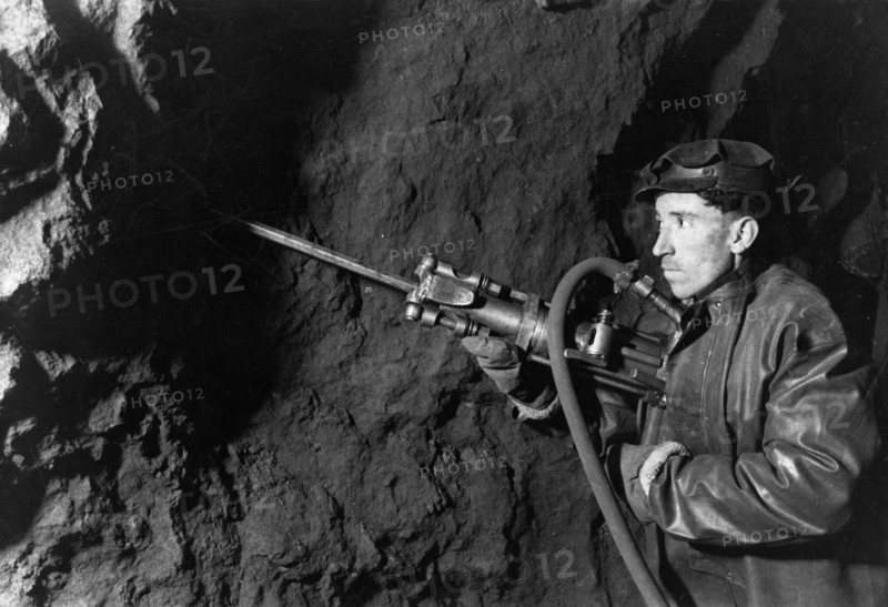 Chapai sozayev working in a mine in the 'krasnaya shapochka' (red riding hood) bauxite bed in the northern urals, ussr, 1947.