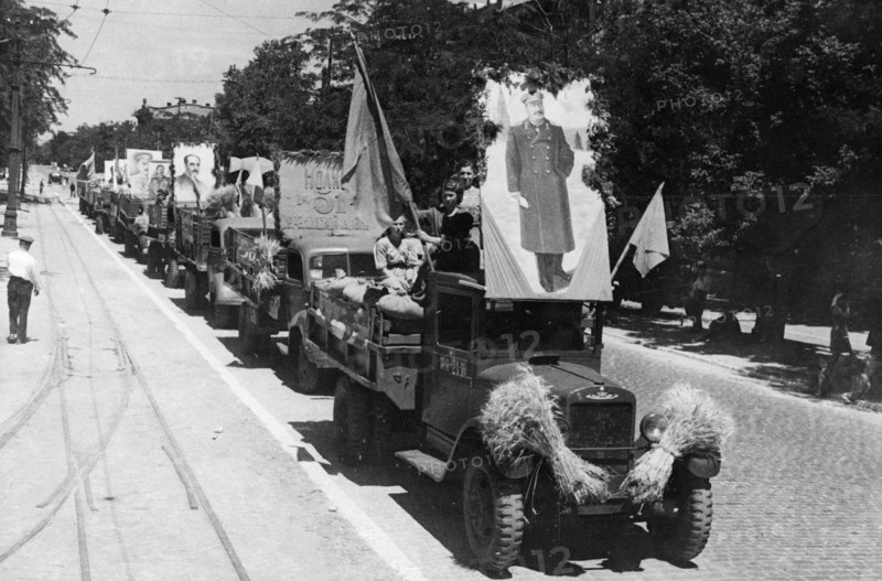 Collective farmers of the odessa region riding to the state elevators with a load of newly harvested grain, ussr, august 1947.