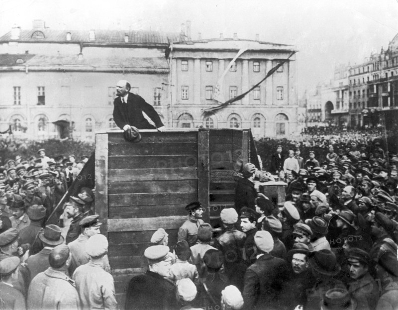 V,i, lenin speaking to red army troops leaving for the front (civil war period), sverdlov square, moscow, may 5th 1920, this is an altered image: the figure of leon trotsky standing in the area with steps behind the speakers' platform has been painted out.