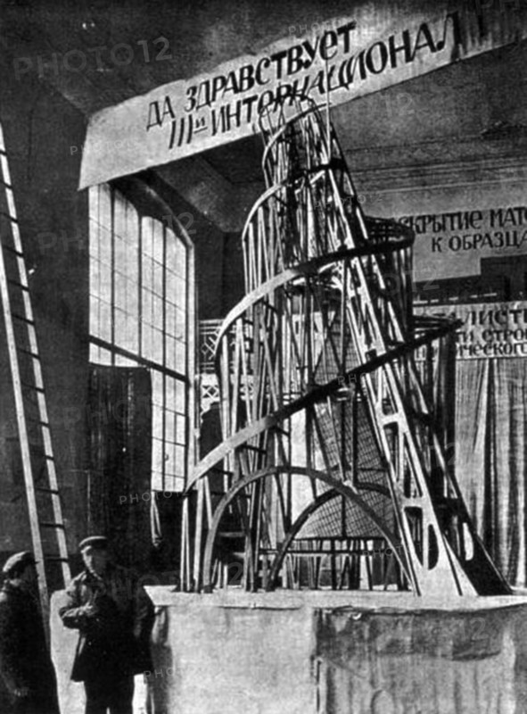 The monument to the third international (tatlin's tower) by vladimir tatlin, the model of the proposed tower in the studio of materials, volume, and construction (the former academy of arts) in petrograd, 1920.