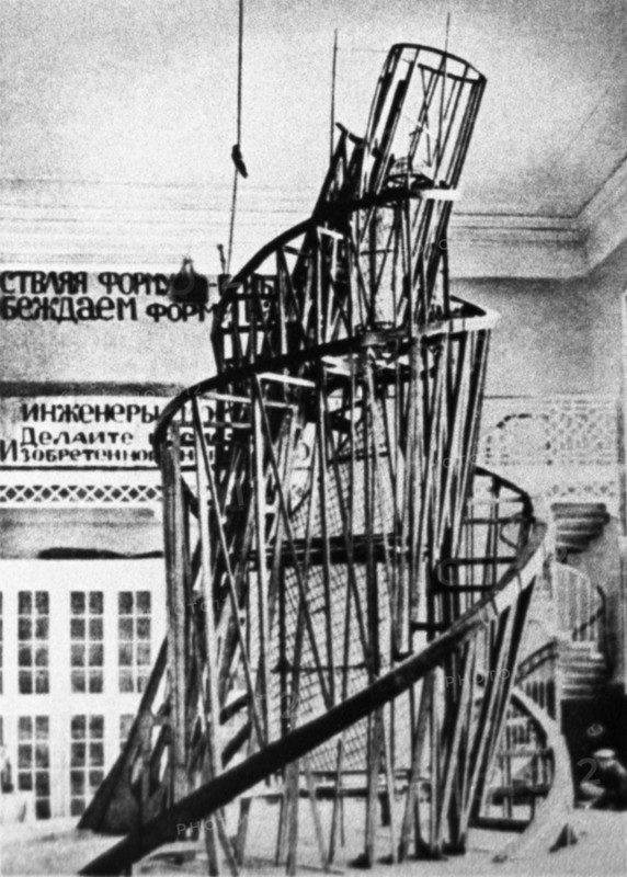 The monument to the third international (tatlin's tower) by vladimir tatlin, the model of the proposed tower in the studio of materials, volume, and construction (the former academy of arts) in petrograd, 1920.