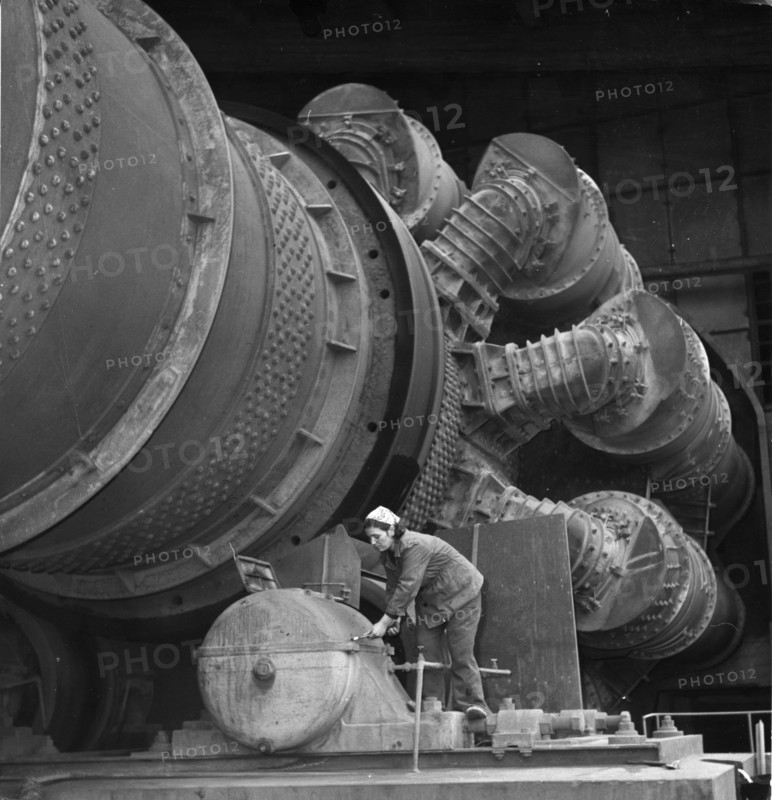Woman working on a furnace in the 'vulkan' cement plant, 1964.