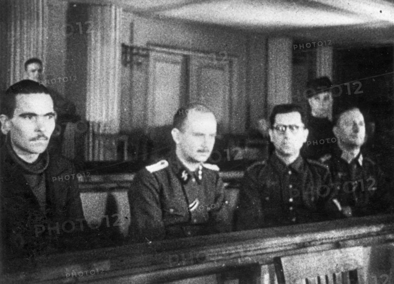 World war 2, december 15, 1943, still from a film on the kharkov trial produced by artkino, the four defendants at the kharkov trial - (l to r) russian traitor mikhail bulanov, hans ritz, reinhard retzlaw, and wilhelm langheld.
