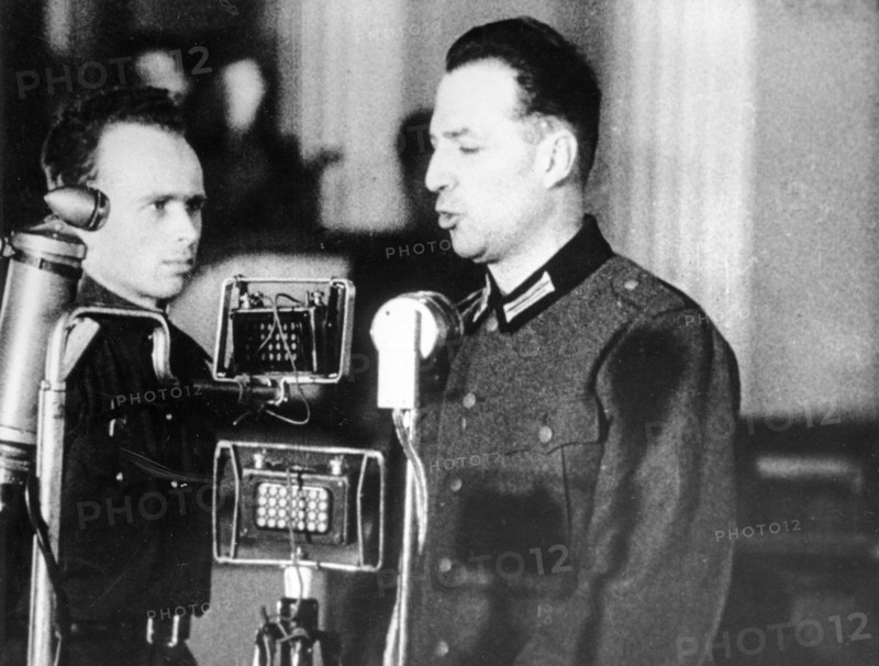 World war 2, december 15, 1943, still from a film on the kharkov trial produced by artkino, wilhelm langheld pleads guilty, langheld spoke in german which was translated by the man at his side.