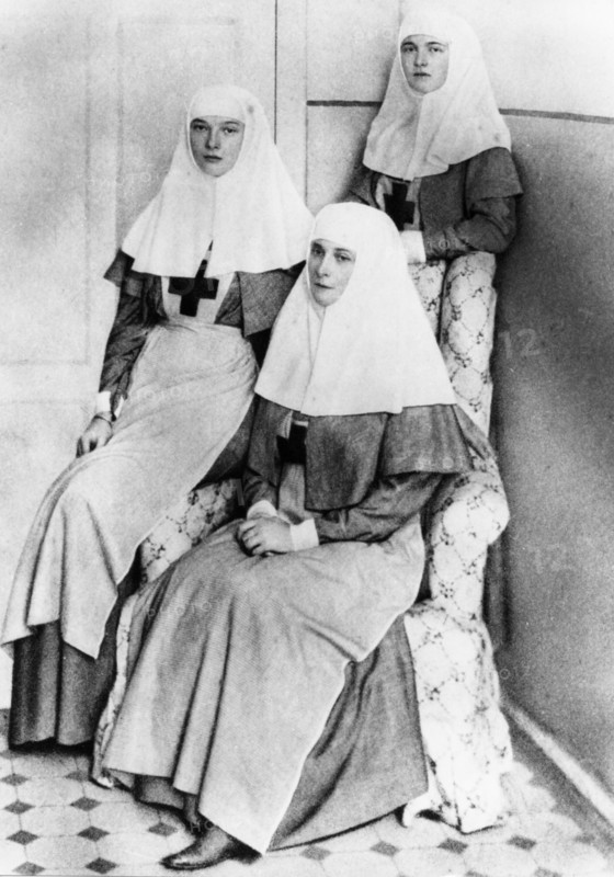 Empress alexandra and her daughters olga and tatiana after finishing the complete nursing course and receiving diplomas from the international red cross, 1914.