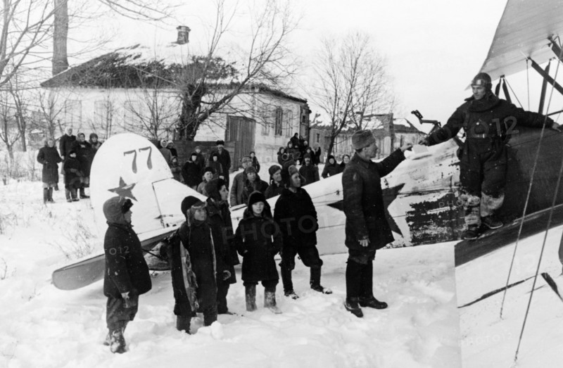World war 2, a soviet polikarpov po-2 (u-2) plane in liberated byelgorod in february 1943, the people are giving the pilot letters to relatives to mail.