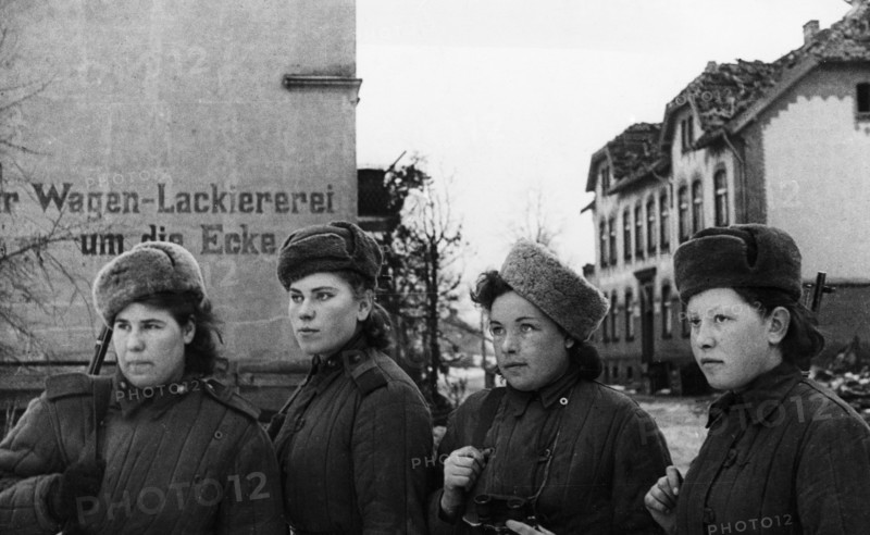 Third belorussian front, world war 2, a group of young women, red army snipers who have 2,000 german kills between them, inspecting a small town in east prussia that has been taken by the soviet army, february 1945.