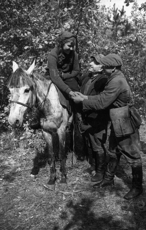 World war 2, in the very first days of the german occupation, dussya davidovich joined a guerilla detachment as a medical nurse, when her detachment merged into the red army the girl asked command for permission to join the red army, here she is parting with her partisan friends upon leaving for an army unit.