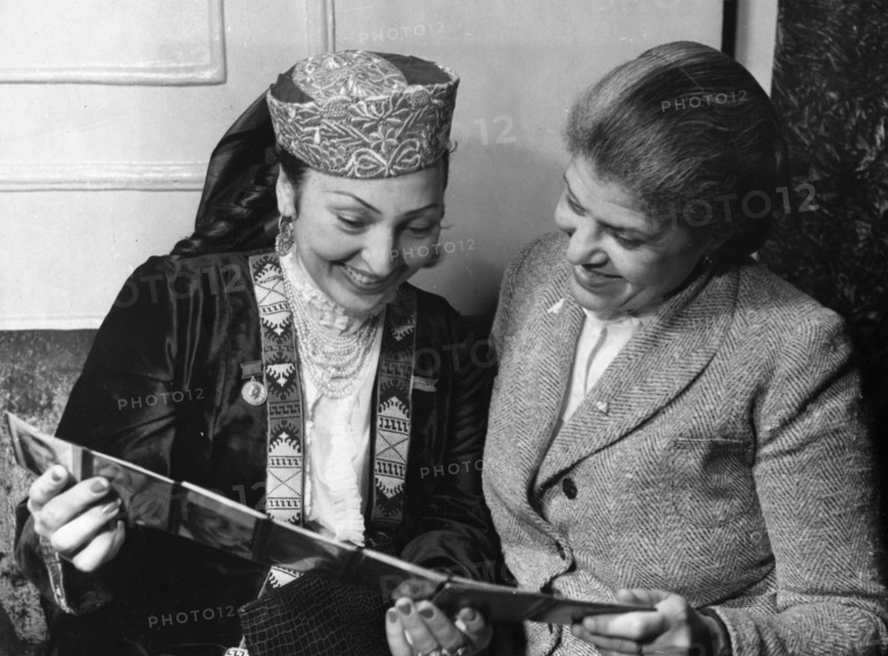 Council of women's international democratic federation holds session in moscow, november 1949, eslanda robeson, vice-president of the american women's congress, and people's artist of the uzbek republic temars khanum, during the intermission between sittings of the session.