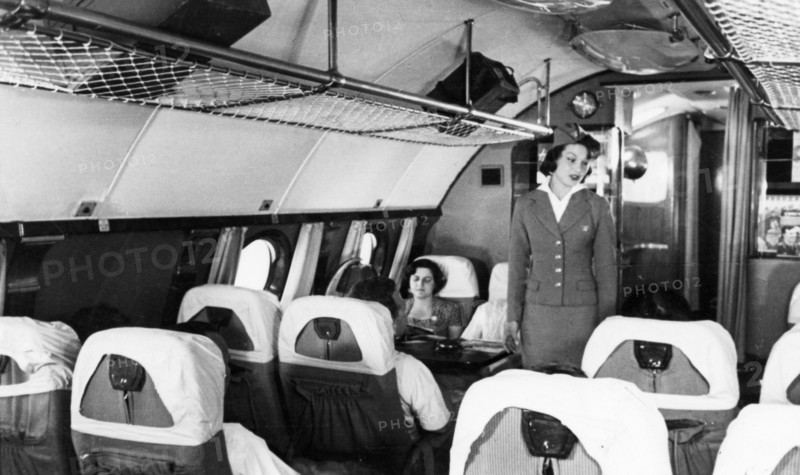 A stewardess and passengers aboard a tu-114 airliner (at the time, the world's largest), 1959.