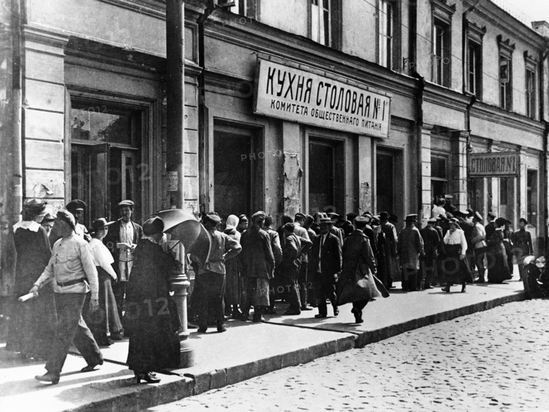 Moscow residents lining up at a canteen of the moscow public catering committee in 1921.