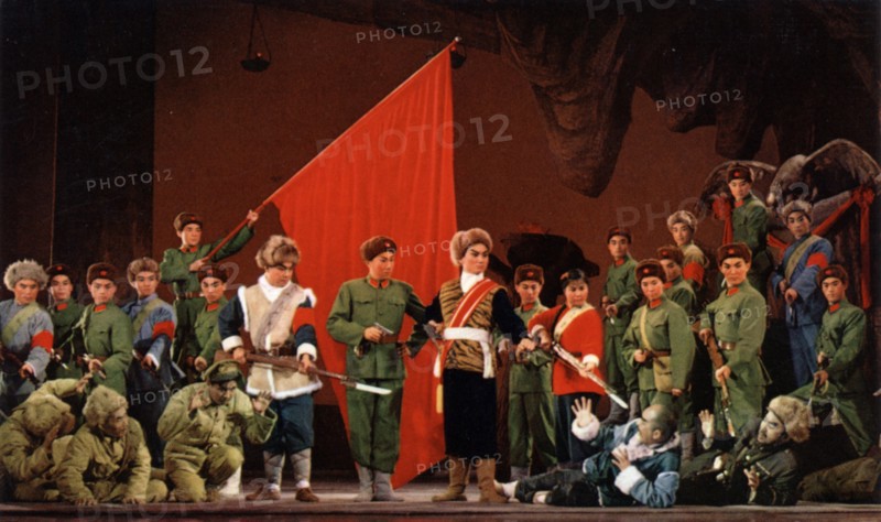 The modern revolutionary peking opera 'taking tiger mountain by strategy', carefully revised, perfected and polished to the last detail with our great leader chairman mao's loving care, now glitters with surpassing splendour,' from a postcard set issued in china in 1970, 'scene 10 - yang tzu-jung and the pursuit detachment, striking from within and without, destroy the bandits and capture the bandit chieftain vulture,'.
