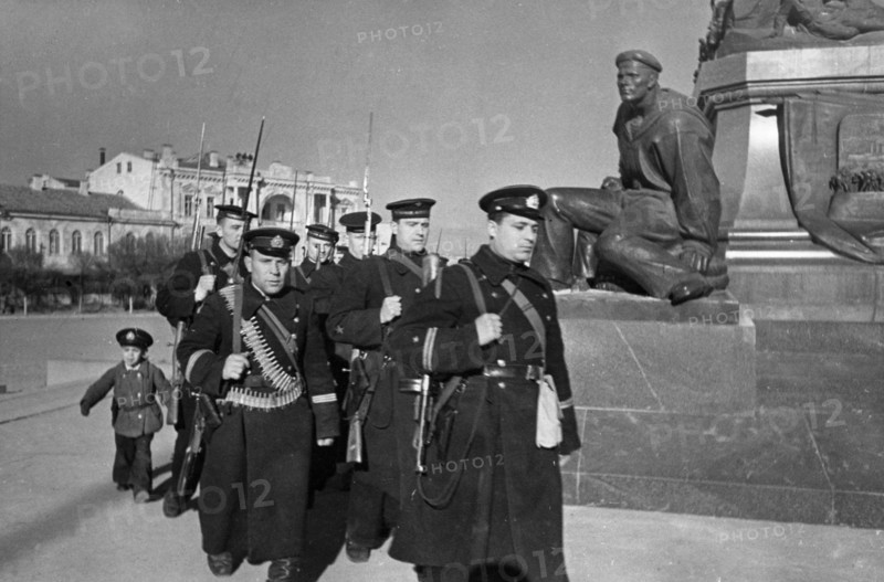 World war 2, defense of sevastopol, a little 'hero' seeing off red navy men to the advanced lines, april 1942.