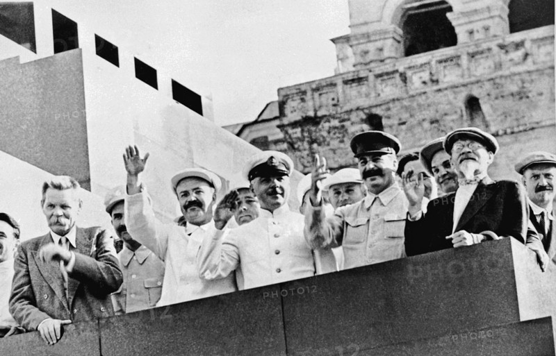 Maxim gorky, vyacheslav molotov, k, voroshilov, joseph stalin, ,mikhail kalinin and nikolai bulganin (left to right) on the platform of the lenin mausoleum during a sports parade in red square, moscow, july 24, 1934.