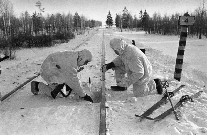 Soviet paratroopers in the enemy's rear, sappers placing mines under railway track, january 1942.