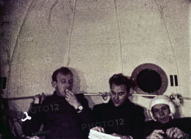 Cosmonauts vladimir shatalov, evgeni khrunov, alexei eliseyev, and boris volynov eating dinner aboard soyuz 4 after leaving soyuz 5, july 1969.