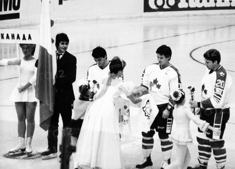Traditional 'bread and salt' of hospitality being presented to the canadian ice hockey team during the opening ceremonies of the izvestia prize international ice hockey tournament on december 16, 1986.