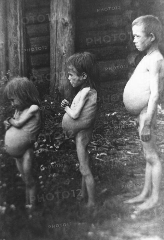 Famine, soviet union, 1922, three starving orphans aged 5,7, and 12 in a village on the volga.