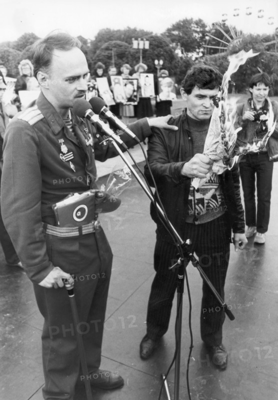 Major n, petrov, a veteran of the afghan war, and his friend burn an issue of the 'krasnaya zvezda' (red star) newspaper, the official organ of the ussr ministry of defense, in protest against the newspaper's coloring the truth about life in the soviet army, the protest was organized by soldiers' mothers in june 1990.