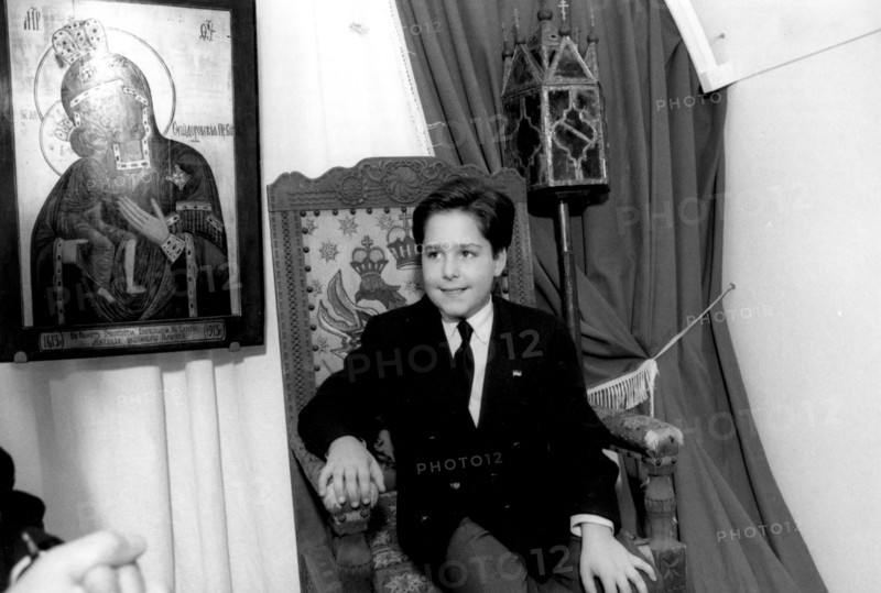 Kostroma, russia 9/92: 11-year-old grand duke georgy mikhailovich romanov sits in the czar's chair in the ipatyevsky monastery, where the first romanov, mikhail, sheltered his mother in 1613 during the time of troubles .