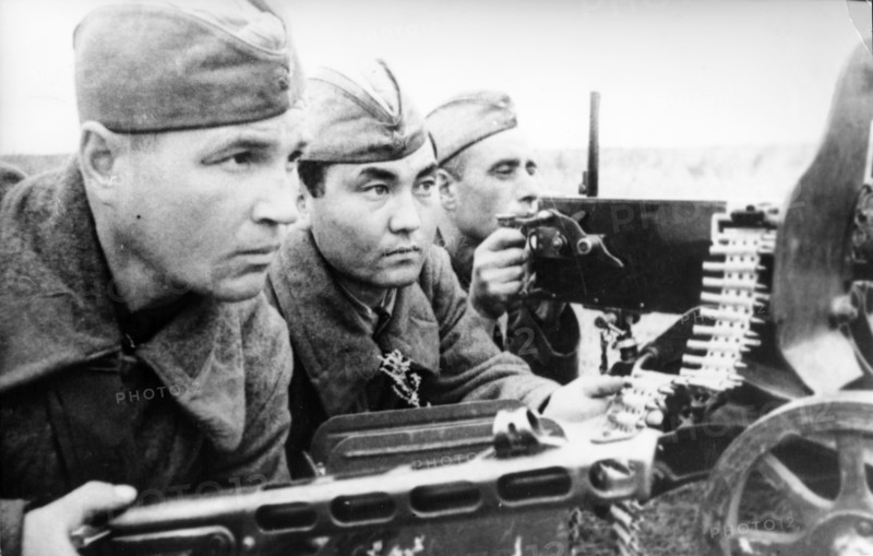 Russian kolesnikov, kirghiz azhekinbayev and ukrainian chepenev, a machine-gun team was fighting against fascists near stalingrad in 1942.