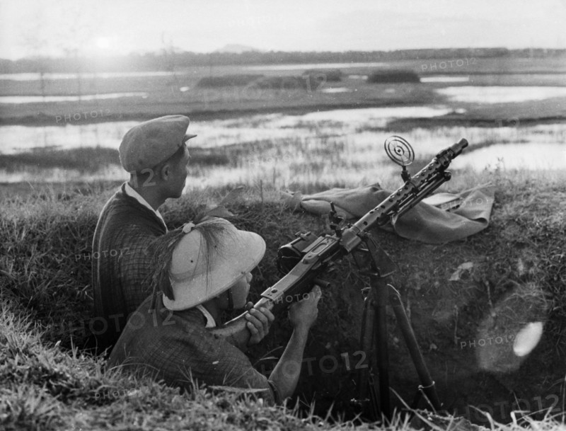Ant-aircraft machine gunner guarding the skies over the town of vinh, north vietnam, 1965.