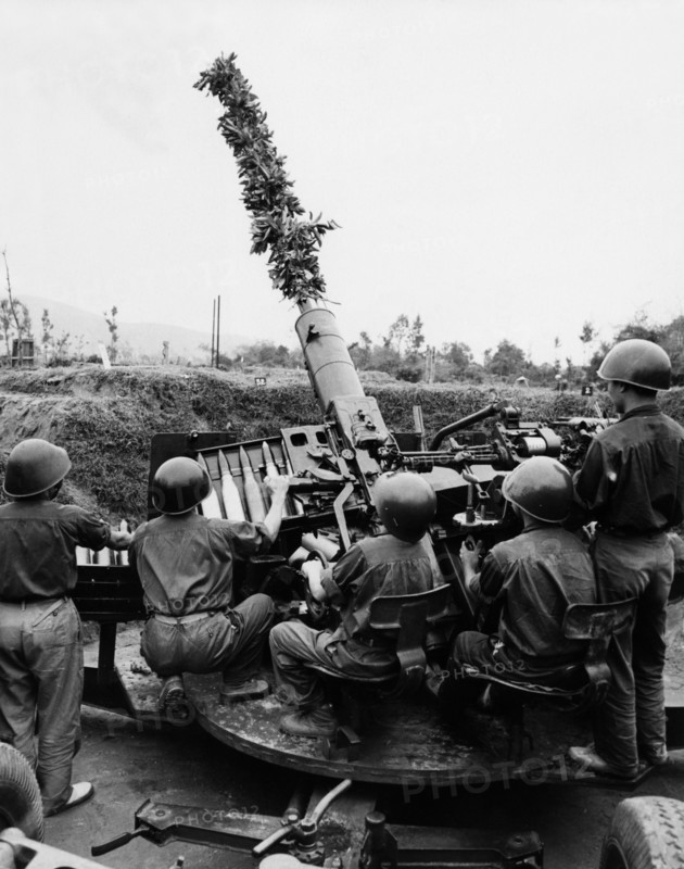 Ant-aircraft gunners of the vietnamese people's army at a firing point in the ngean province, north vietnam, 1969, s-60 57mm anti-aircraft gun; 70 rounds per minute.